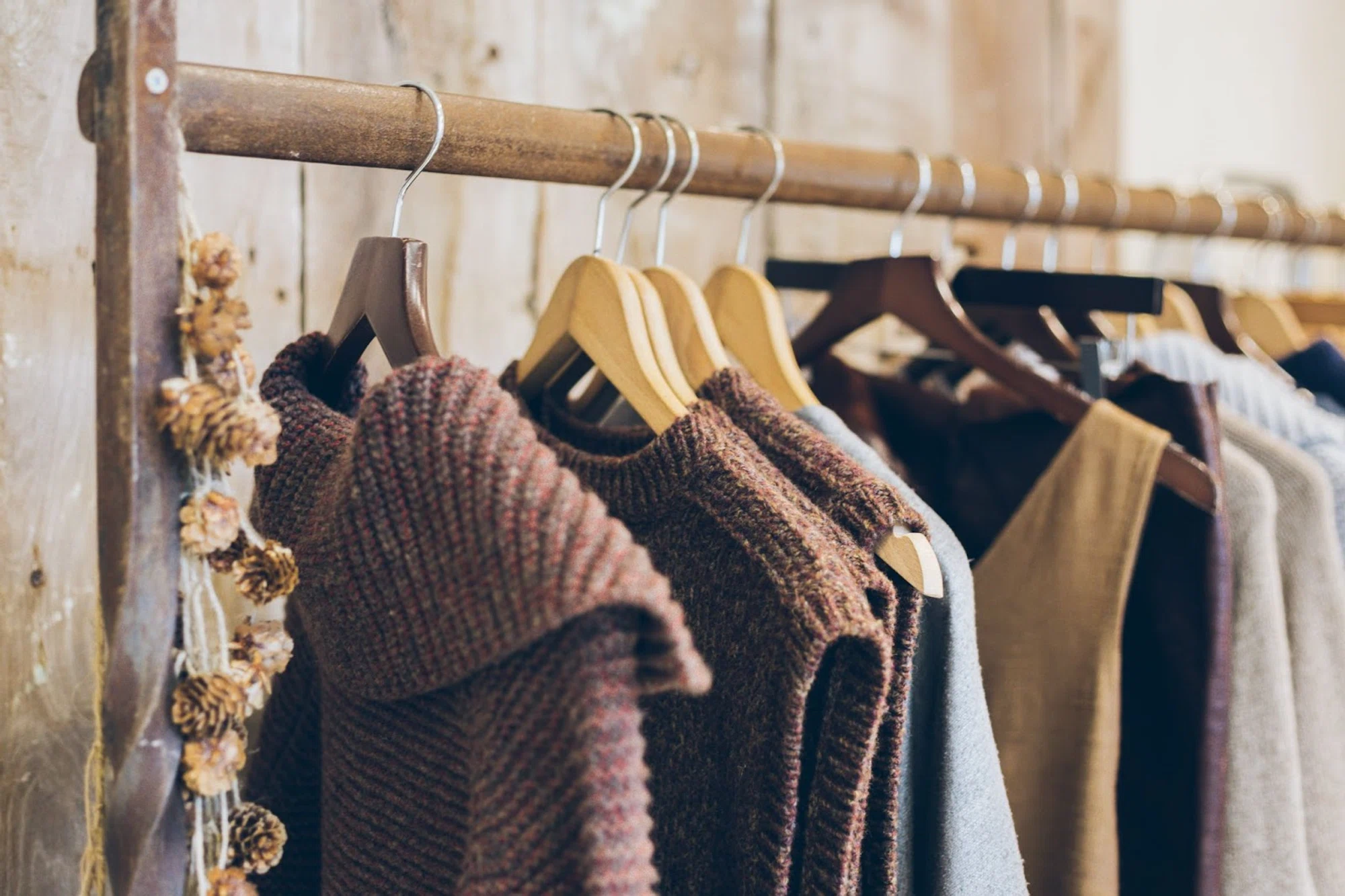 Winter sales and post-holiday seasonal clearances start to kick in right after Christmas, as well as in January and July. Pictured is a clothing rack of warm sweaters. 